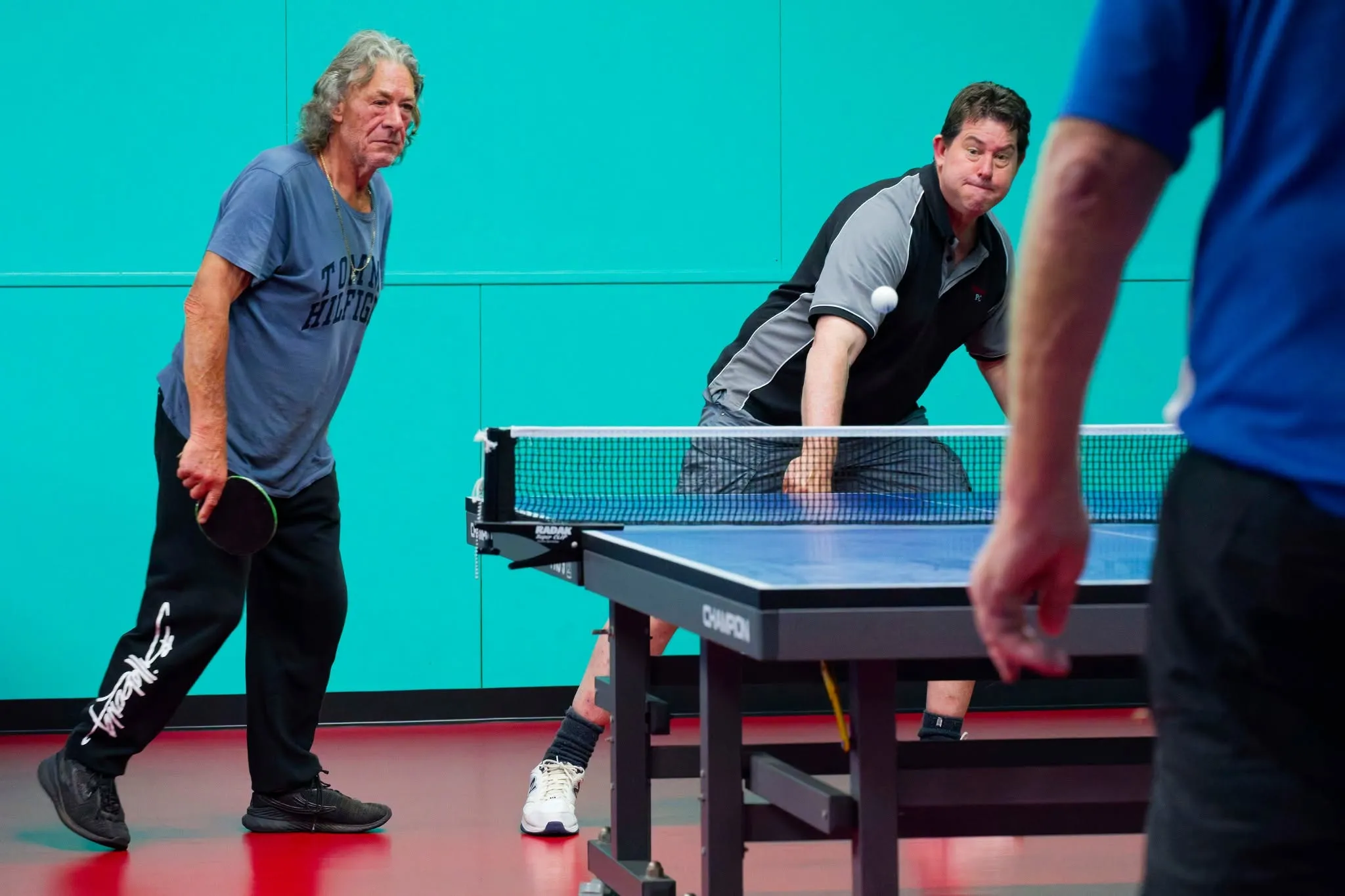 A doubles match in progress at the Devonport clubrooms